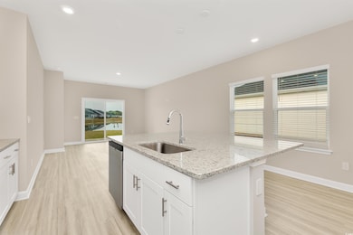 Kitchen featuring light wood finished floors, base