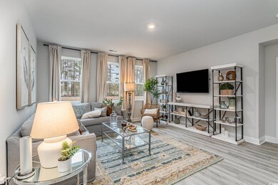Living room with plenty of natural light and wood-