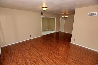 Enter the spacious living room from the covered fr