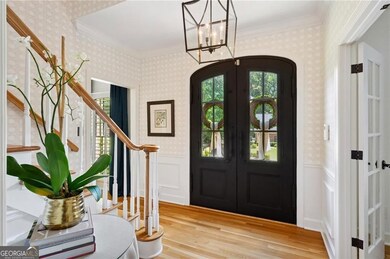 Arched Double Front Doors with Operable Glass Panels