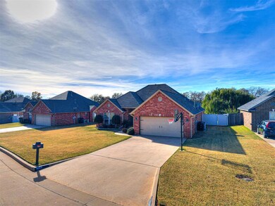 Another view of front of home showing built in basketball goal, mailbox & address labeled driveway.