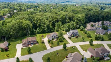 Aerial View shows immaculately manicured Pierce Bluffs Development.  Shenango Lake and Dam a short distance away.