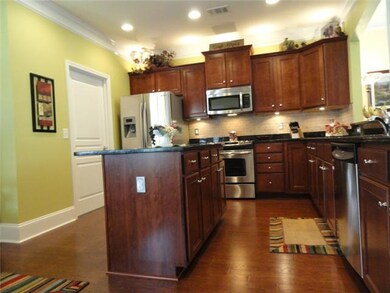 Convenient kitchen island with plug, additional canned lighting, crown molding and 7 1/4 baseboards make this kitchen breathtaking!