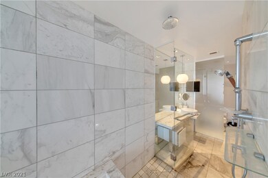 Walk in shower with Adjustable showerhead.