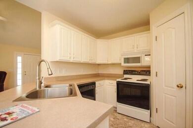 A kitchen you will love. Crisp white cabinetry with plenty of counter space and a pantry area.