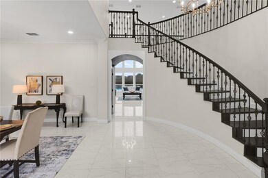 Foyer and Dining
Arched Doorway leads to Living A