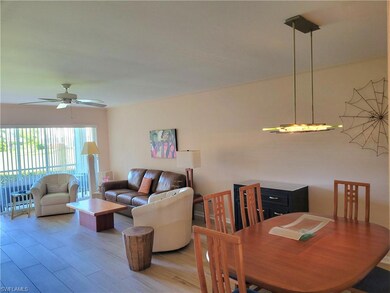 Living area featuring wood finished floors and ceiling fan