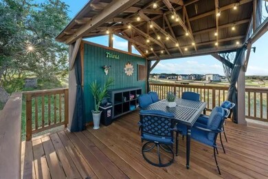 Wooden terrace featuring outdoor dining area
