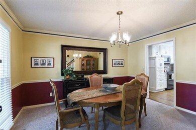 Dining room off of kitchen is spacious and capable