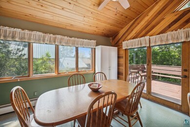 Dining space featuring wooden ceiling, plenty of n