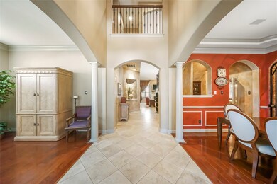 Grand inviting entrance with wood and tile flooring!