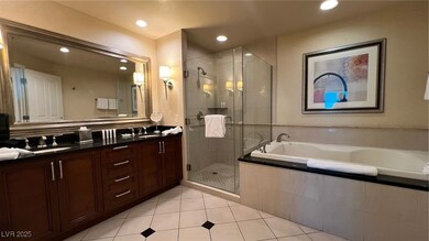 Bathroom with a sink, double vanity, a stall showe