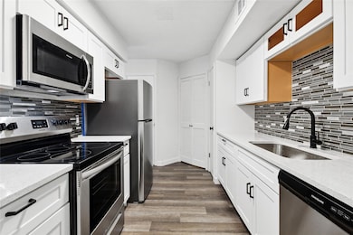 Kitchen featuring stainless steel appliances, sink