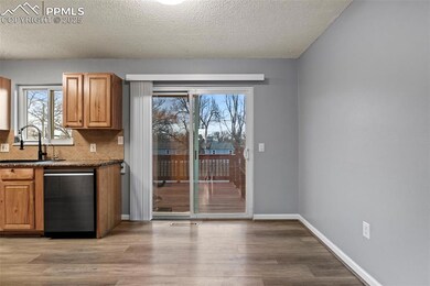 Kitchen with a textured ceiling, stainless steel d