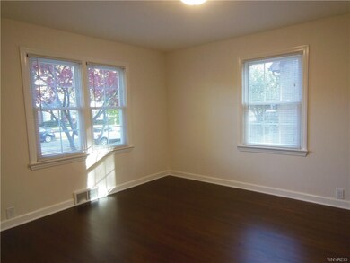 Dining room with gleaming hardwood flooring.