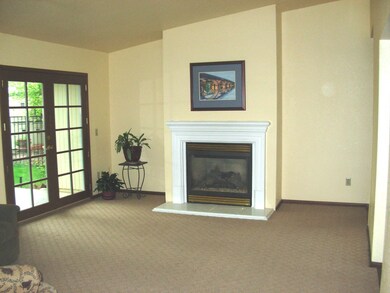 living room with French door & fireplace