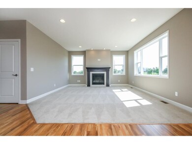 Light-filled family room with gas fireplace.