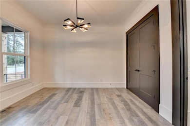 Unfurnished dining area with a chandelier, visible