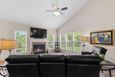 The family room includes a gas fireplace and lots of windows for natural light!