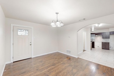 Foyer entrance featuring an inviting chandelier an