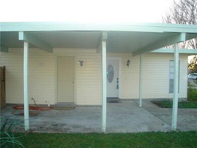 View. View of two entryways under carport. Enter t