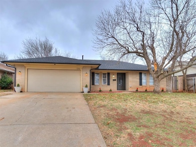 Ranch-style home with driveway, a front yard, a sh