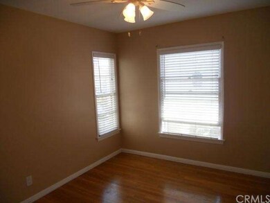 Bedroom with ceiling fan and light
