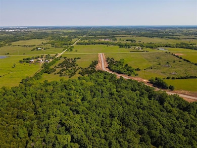 View of rural area with a heavily wooded area