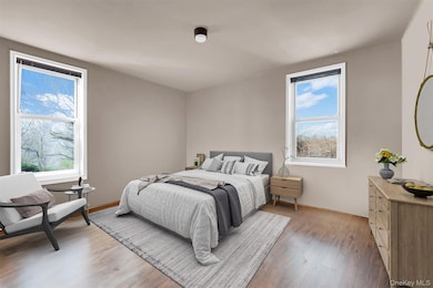 Bedroom featuring wood finished floors