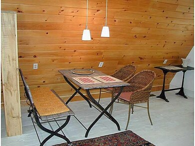 Dining Room. The dining table is across from the k