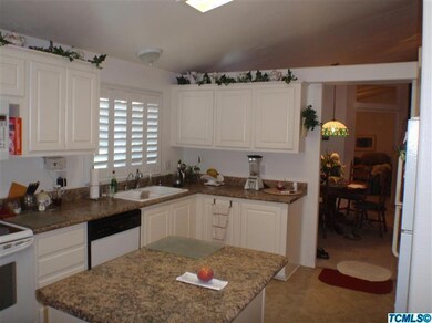 Kitchen sink area, newly painted cabinet