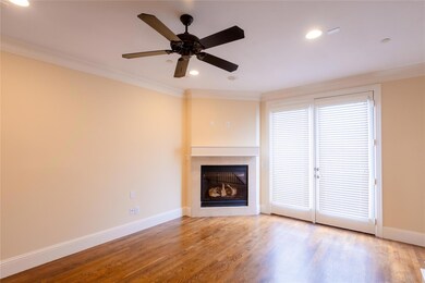 Unfurnished living room featuring ceiling fan, orn