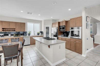 Kitchen with stainless steel appliances, light cou