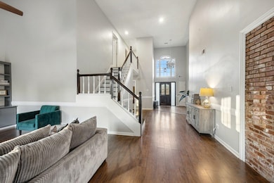 Entrance foyer featuring a towering ceiling and da