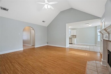 View looking into the living, kitchen and foyer ar