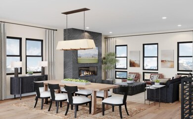 Great room featuring light wood finished floors, a premium gas fireplace, lots of natural light, and 10ft ceilings.