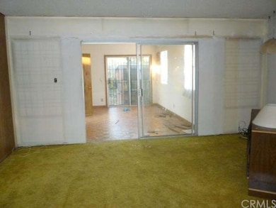 View from living room to den.  Sliding door opens 