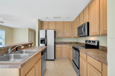 Conveniently, the KITCHEN opens to the main living