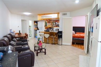 Living room featuring light tile patterned floors 