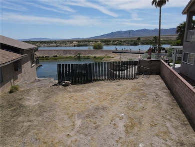 View of yard featuring a water and mountain view