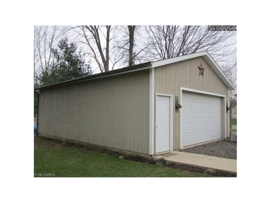 Concrete floor and overhead doors at front and rea