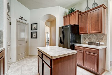 Another Great View Of Kitchen With Walk In Pantry.  Utility Room Just Off Of Garage & Kitchen.