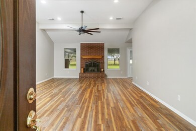 Living room space, brick fireplace
