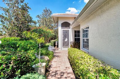 Paved walkway with brick pavers to the front screened porch annd  entry door.