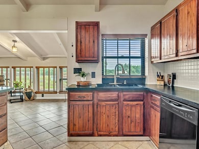 Beautiful cabinets with lots of storage and dishwasher, stove, built in microwave and fridge  stay