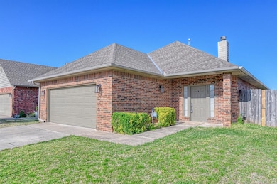 Ranch-style house featuring brick siding, a front 