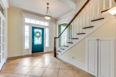View toward front door. Lots of under stair storage