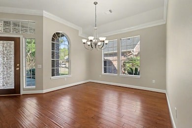 Beautiful Dining Room with high ceilings and crown molding, ample space to host everyone at your next event.