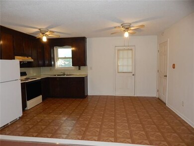 Kitchen /Dining room Rear door leads to back yard.