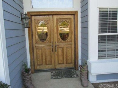 Front doors with etched beveled glass windows.